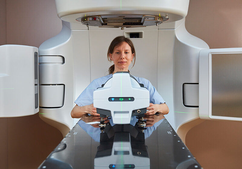 Medical physisict placing Delta4 Phantom+ on Truebam table